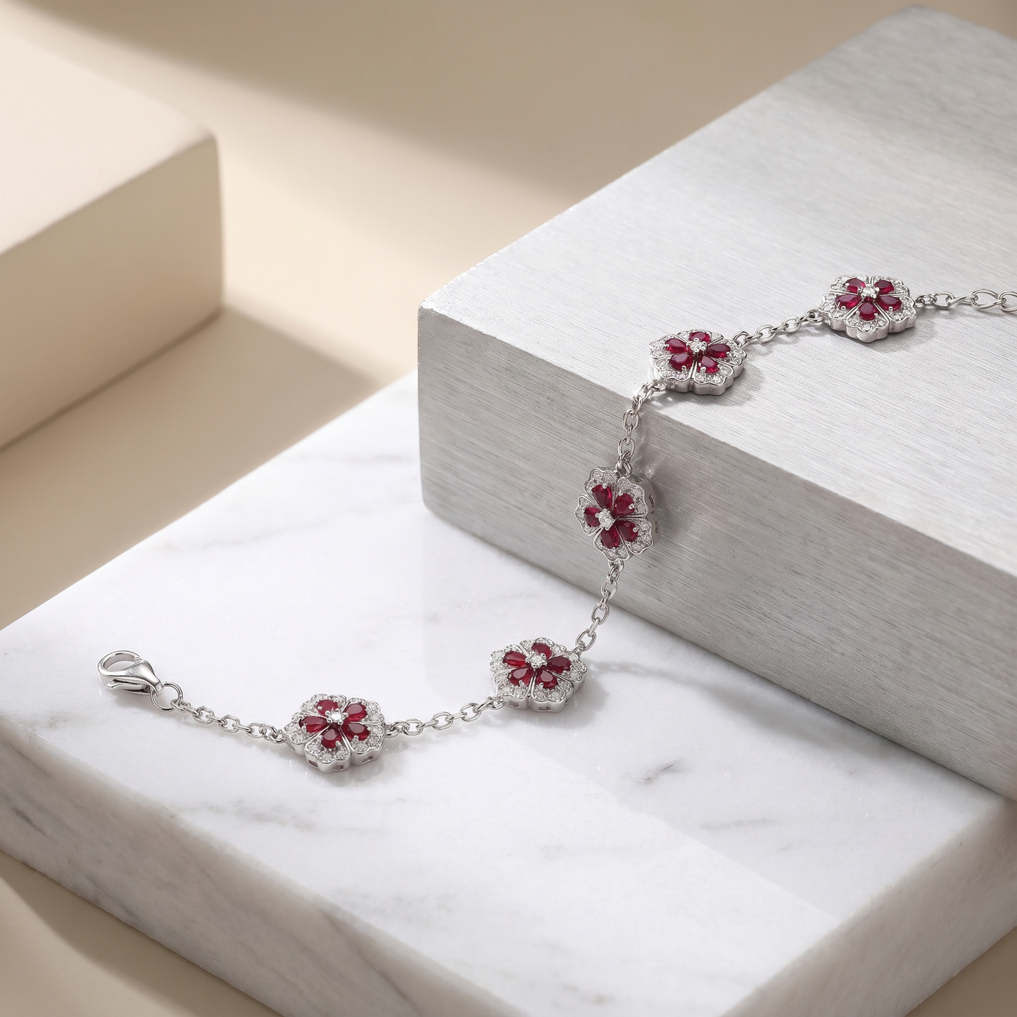 Sterling Silver Floral Bracelet – Ruby-Red Stones & Moissanite Accents