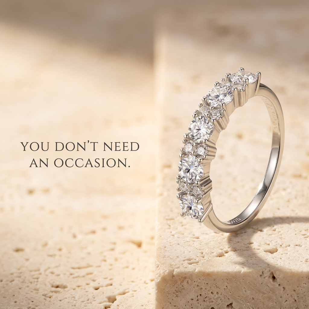 Velara Milano moissanite half-eternity ring on travertine surface, quiet luxury product photo