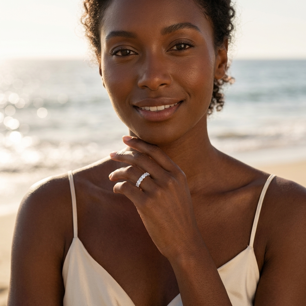 American model wearing Velara Milano moissanite half-eternity ring, golden hour coastal setting